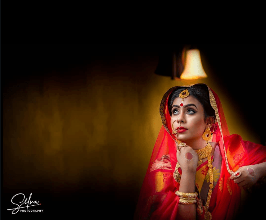Bridal portrait in red with traditional jewellery